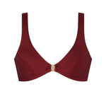 Woman wearing the ERY brown bikini top with gold clasp, minimal and sport-chic cut – handcrafted in Italy