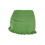 Green Lola skirt, back view with smooth finish and soft frill.