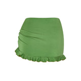 Green Lola skirt, back view with smooth finish and soft frill.